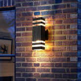 Wall-mounted outdoor light fixture on a brick wall