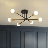 Modern ceiling light fixture with six white bulbs on a neutral background