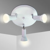 Ceiling light fixture with three white bulbs on a gray ceiling.