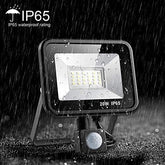 LED flood light with IP65 waterproof rating in a rain simulation