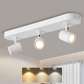 Ceiling light fixture with three adjustable lights on a neutral background