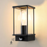 Black outdoor wall light fixture with motion sensor on a neutral background