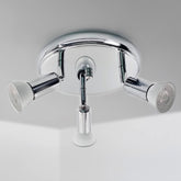 Chrome bathroom faucet with two handles on a light gray background