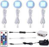 Set of LED lights with remote control and power adapter on a white background