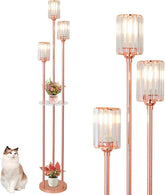 Decorative floor lamp with multiple lampshades and a cat sitting next to it.