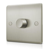 Metallic light switch with a knob on a white background