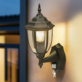 Outdoor wall light fixture with motion sensor on a blurred background