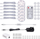 LED light kit with remote control, batteries, and accessories on a white background