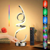 Decorative LED lamp with remote control displaying RGB color options on a wooden surface.