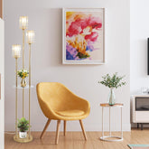 Modern living room with a yellow chair, floor lamp, and colorful abstract painting.