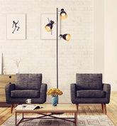 Modern living room with two gray armchairs, a coffee table, and a floor lamp.