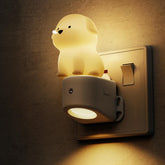 Dog-shaped night light attached to a wall switch
