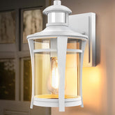 White outdoor wall light fixture with glass cover on a wall.