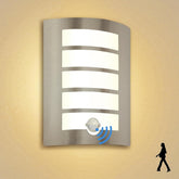 Modern wall-mounted light fixture with sensor on a beige wall.