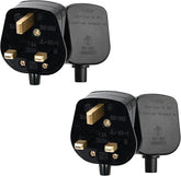 Two black electrical plugs with gold contacts on a white background