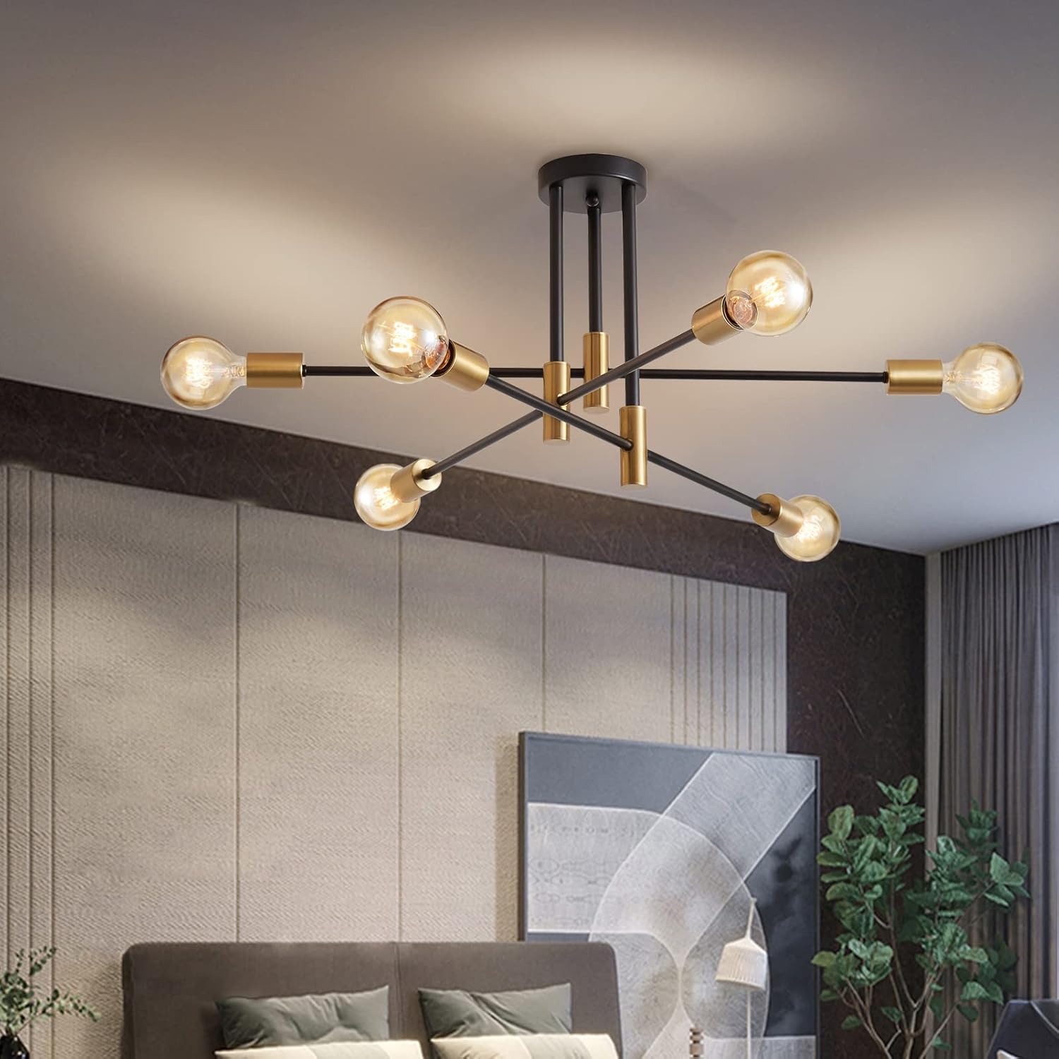 Modern chandelier with multiple light bulbs in a living room setting.