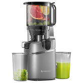 Amzchef juicer with fruits and a glass of green juice on a white background