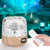 Aromatherapy diffuser with wooden base and remote control in a living room setting.