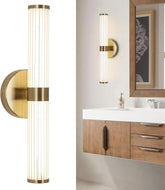 Bathroom with gold wall sconces and wooden vanity