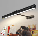 Black LED reading lamp with remote control on a gray background