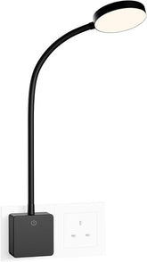Black adjustable desk lamp with a white light on a white background