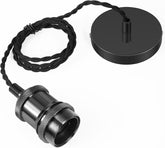 Black metal lamp with cord on a white background