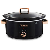 Black slow cooker with rose gold accents on a white background