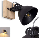 Black wall-mounted lamp with wooden base and visible bulb on a white background