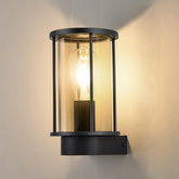 Black wall-mounted outdoor light fixture with glass cover on a neutral background