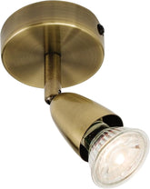 Brass wall light fixture on a white background