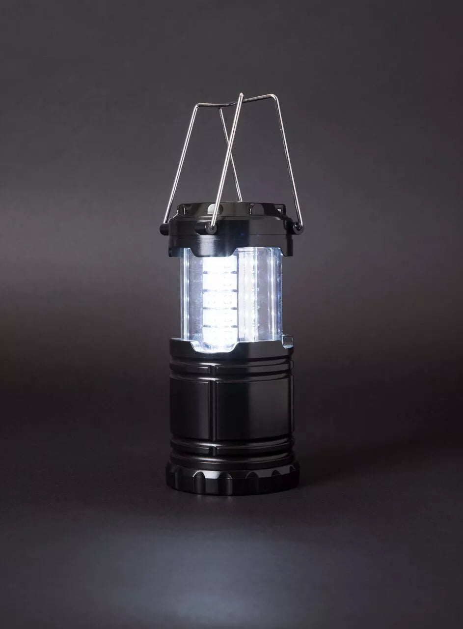 Torch near a camping tent