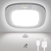 Ceiling light fixture with motion sensor and USB charging ports on a white background