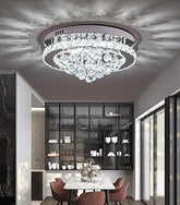 Chandelier hanging in a modern dining room with a table and chairs.