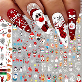 Christmas-themed nail art stickers with Santa Claus, snowmen, and reindeer on a gray background.