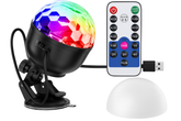 Colorful disco ball with remote control and stand on a white background