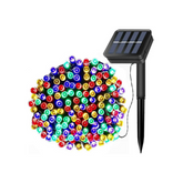 Colorful string lights with a solar panel and stake on a white background