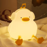 Cute chicken-shaped night light on a soft surface