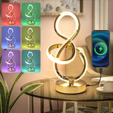 Decorative lamp with color-changing options on a table next to a smartphone.