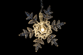 Decorative snowflake light on a black background