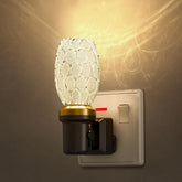 Decorative night light attached to a wall switch with a warm glow.