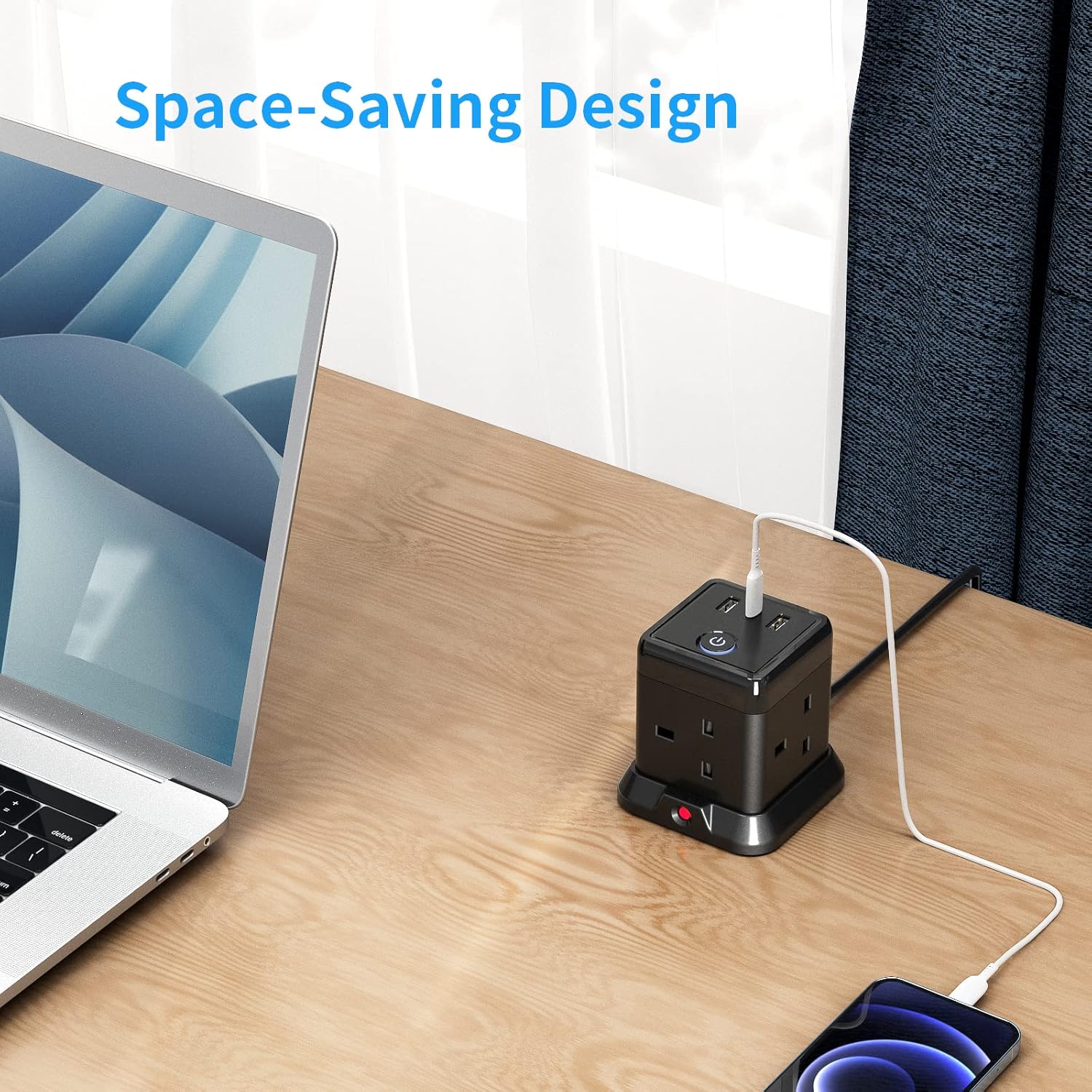 Desk with laptop, smartphone, and power strip emphasizing space-saving design.
