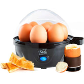 Egg cooker with eggs and toast on a white background