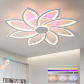 Floral-shaped ceiling light fixture in a modern room setting with remote control.