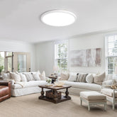 Close-up of the sleek 2.4cm profile of the round ceiling fixture.