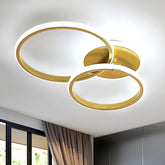 Gold circular ceiling light fixture on a white ceiling
