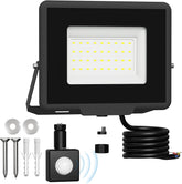 LED flood light kit with black housing, sensor, and wiring on a white background