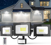 LED flood lights with remote control in front of a house at night