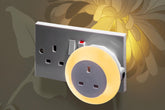 Light switch with night light feature on a floral background
