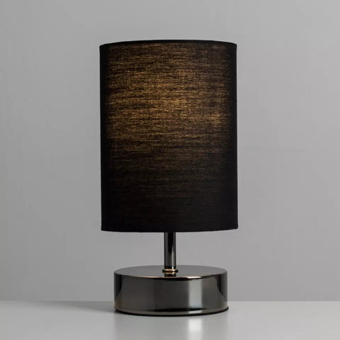 Lamp illuminating a cozy bedroom setting with adjustable brightness.
 Lamp illuminating a cozy bedroom setting with adjustable brightness.