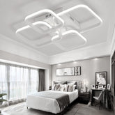 Modern bedroom with a stylish ceiling light fixture.